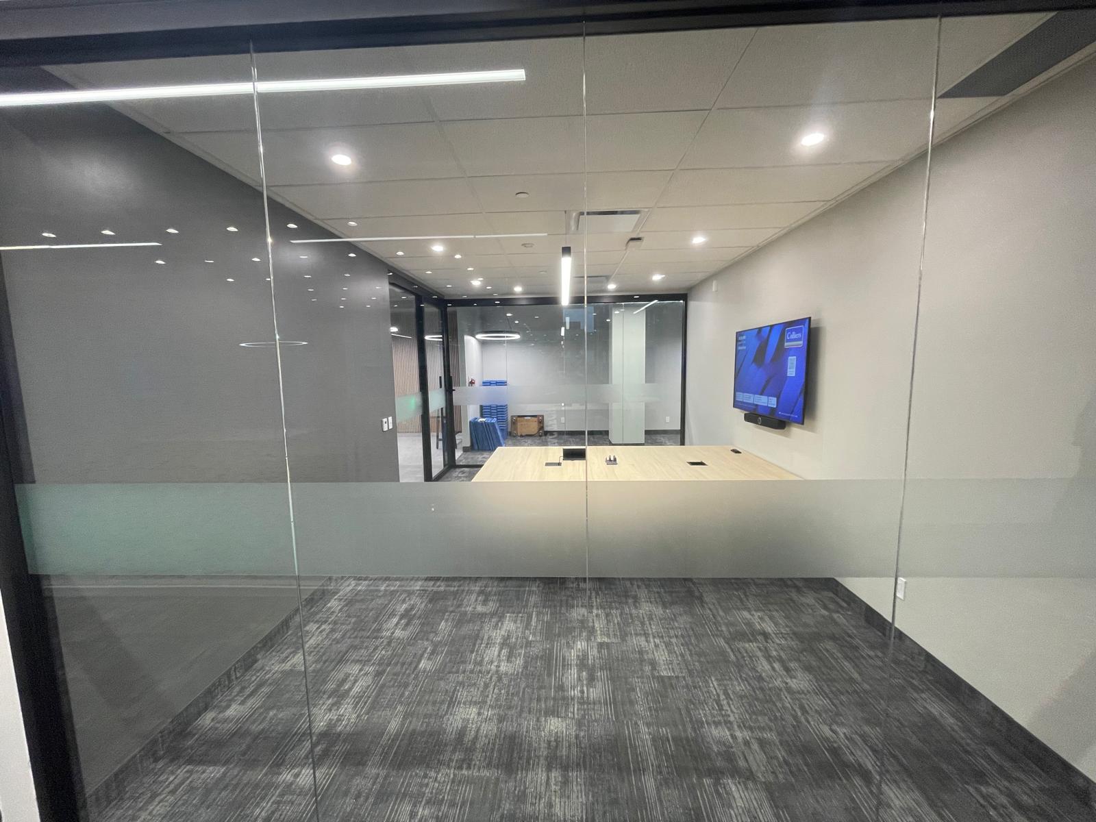 345 King Suite 200 glass meeting room with integrated presentation screen