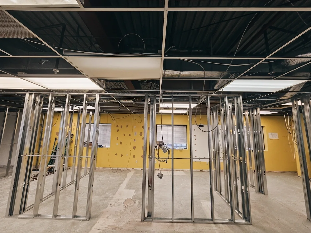 1050 Finch during: glass partitions being framed along the window wall